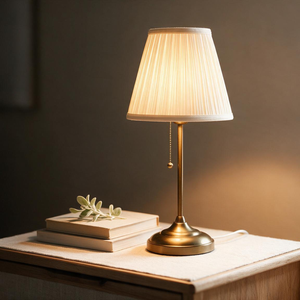 BrassGlow brushed brass table lamp in a warm, cozy styled room