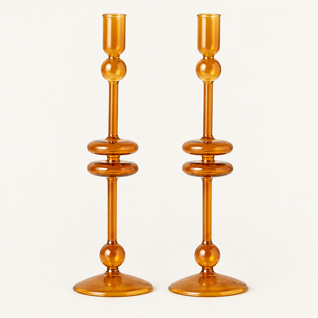 Amber Glass Taper Candlesticks, Set of 2 on a plain off-white background