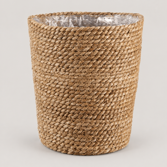 Rush Fibre Waste Basket with Plastic Liner on a neutral background