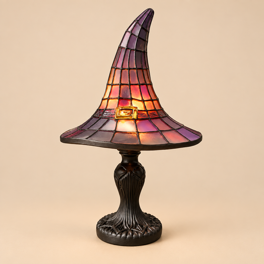 Stained glass style witch hat table lamp switched on
